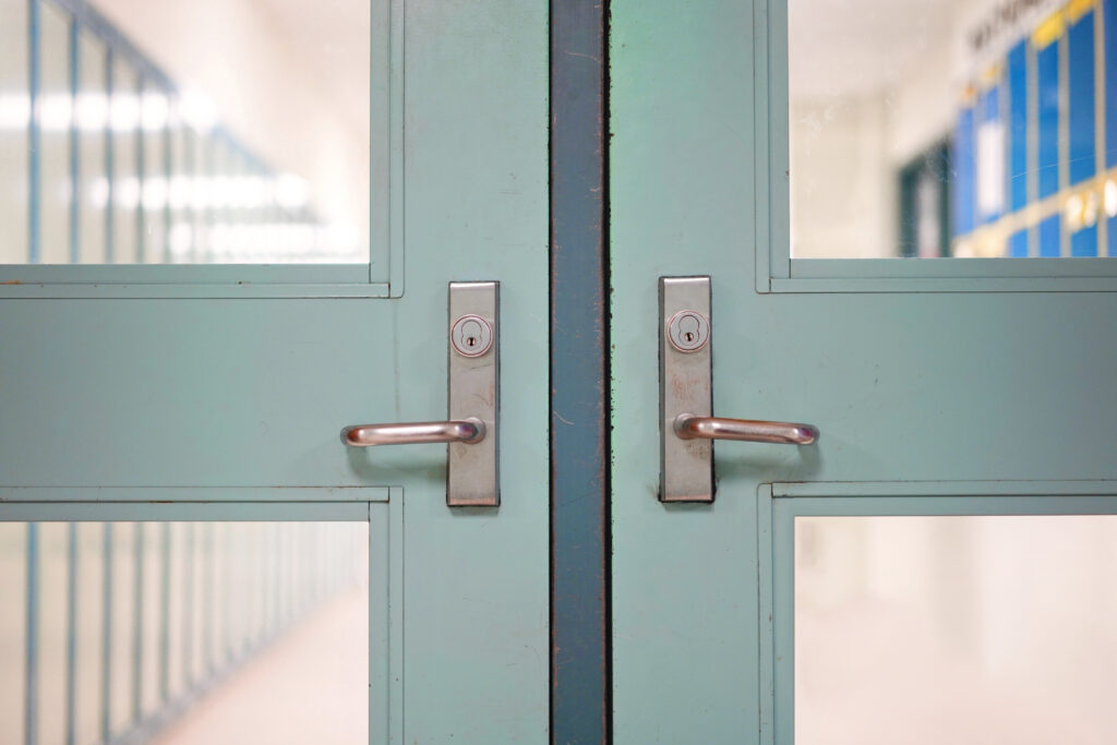 Image of closed school doors.