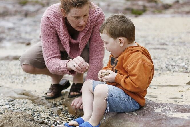 Mom and child looking at rocks